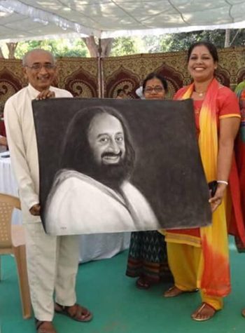 Daya presenting Sri Sri portrait to a devotee